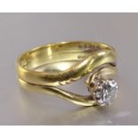 A solitaire diamond ring claw-set a brilliant-cut diamond of approximately 0.36cts, in 18ct yellow