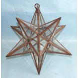 A Moroccan-style glazed star lantern, 40cm diameter, a gold glass 'witch ball', 36cm diameter and