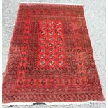 A modern wool rug, the centre with three rows of guls within a multiple border, 290 x 202cm.