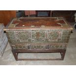 An antique hardwood Arab chest, typically and profusely decorated with stud-work and cut brass