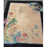 A large wool carpet decorated in the Chinese manner in beige and blue colours, 417 x 300cm, (