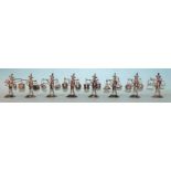 A set of eight early 20th century Chinese silver place card, each in the form of a walking figure,