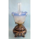 A Doulton Lambeth stoneware oil lamp base with incised decoration of scrolling foliage and