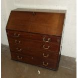 A Georgian red walnut bureau, the fall-front concealing a fitted interior above four graduated