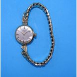A ladies Rotary 9ct-gold-cased wrist watch on plated expanding strap.