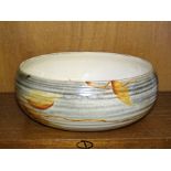 A Clarice Cliff Bizarre ribbed bowl painted with autumnal leaves, 22cm diameter, 9cm high, factory