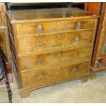 An antique oak rectangular chest of two short and three long drawers, in two parts, with panelled