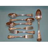 Seven pieces of Georgian Kings pattern silver cutlery, comprising tablespoon, three dessert