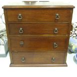 A mahogany miniature chest of four long drawers 35cm wide, 36cm high, 21cm deep