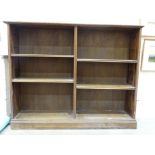 An oak open bookcase with adjustable shelves, 134cm wide, 107cm high, 37cm deep.
