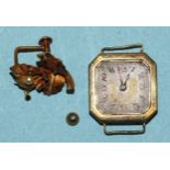 A lady's 18ct-gold-cased square-faced wrist watch, (not working), 11.6g and a single earring