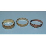 Two 9ct gold wedding bands, one set synthetic white stones, size K½ and a Victorian rose gold signet