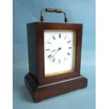 An early-19th century rosewood small mantel clock of rectangular shape, with white enamel dial and
