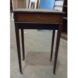 An Edwardian mahogany work table with hinged lid on square tapering legs, 47cm wide, 75cm high, 34cm