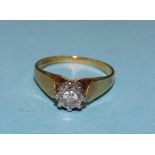 An 18ct gold solitaire diamond ring illusion set a brilliant cut diamond of 0.10cts, M, 3.1g.