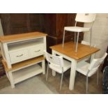 An oak and painted extending dining table, low cupboard and coffee table, with four Ikea chairs.