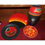 A Poole Pottery 'Eclipse' decorated charger, 35cm, a Poole Pottery 'Millennium' charger, 26.5cm,