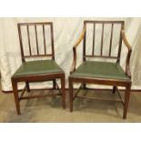 A set of seven Georgian-style mahogany dining chairs with drop-in seats and square tapered legs, (