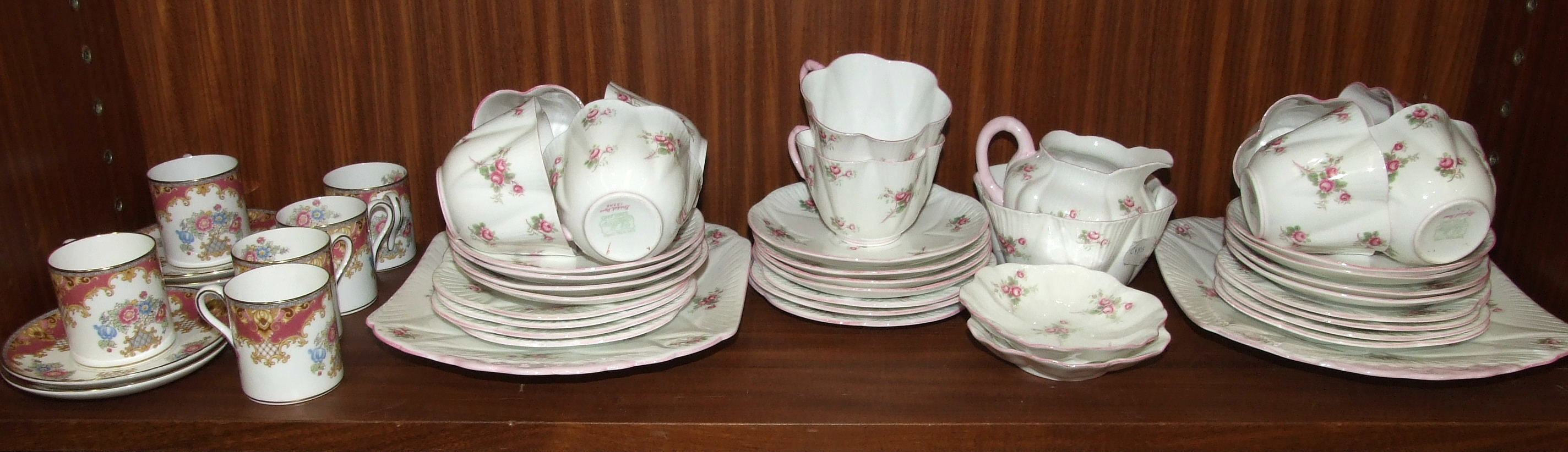 Thirty-nine pieces of Shelley 'Bridal Rose' decorated teaware and six Shelley 'Sheraton' coffee cans