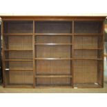 Parts of an Edwardian walnut sectional bookcase, 240cm wide, 161cm high, a mahogany drop-leaf table,