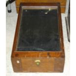 A three-drawer collector's cabinet with glazed top, 53 x 31cm, a large lacquered tea cannister (in