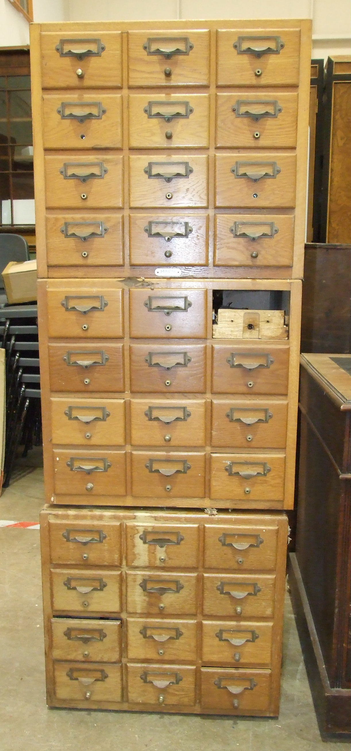 Three oak banks of twelve file card drawers, 51 x 47cm, (3).