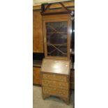 An Edwardian inlaid mahogany narrow bureau/bookcase, 61cm wide, 204cm high.