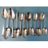 A collection of Georgian Old English pattern silver dessert spoons: three tablespoons and nine