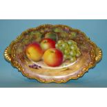 A Royal Worcester two-handled oval dish, hand-painted with apples, grapes and blackcurrants on a