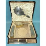A silver dressing table part-set of mirror, three brushes and tortoiseshell comb, (powder pot