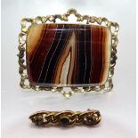 A Victorian large banded-agate brooch, the rectangular plaque in unmarked gold-plated mount and a