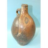 An early baluster stoneware salt-glazed jug with loop handle and speckled glaze overall, 29cm.