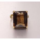 A yellow gold dress ring set large brown citrine, the mount bearing Egyptian marks for 18ct, size O,