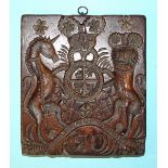 An early-18th century unusual fruitwood gingerbread mould in the form of a royal coat of arms,