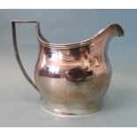 A George III silver cream jug of bellied form, with reeded rim and handle, maker's mark rubbed,