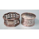 A silver napkin ring with pierced decoration and another silver napkin ring, Birmingham 1925,