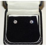 A pair of diamond stud earrings, each claw-set a brilliant-cut diamond of approximately 0.3cts, in