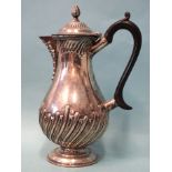 A late-Victorian silver hot water jug of baluster form, with gadrooned decoration, maker William