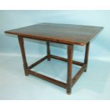 An antique oak side table, the three-plank rectangular top on square partially-chamfered legs and