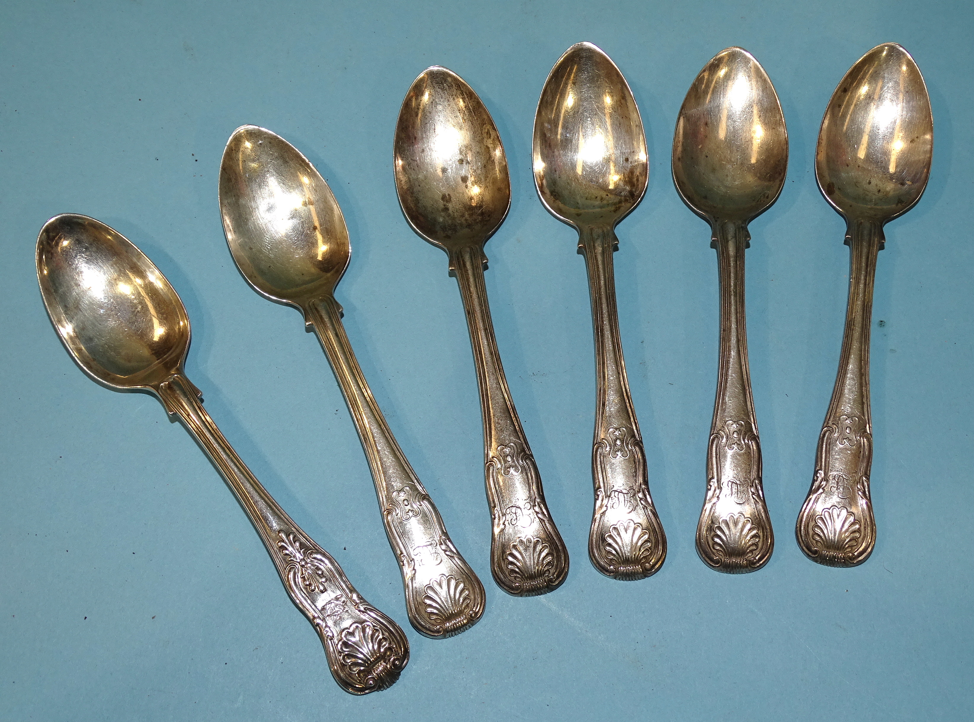 A set of six Irish silver queens pattern teaspoons by RW Smith, Dublin 1836 and another, London