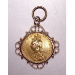 A Queen Victoria sovereign, 1892, George and dragon back, in 9ct gold pendant mount, gross weight