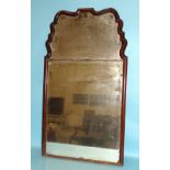 An 18th century walnut-framed wall mirror with two original bevelled plates, the rectangular