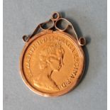 An Elizabeth II half-sovereign, 1982, in 9ct gold pendant mount, 4.8g.