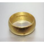 A 22ct gold wedding ring, 7mm wide, size K½, 7.9g.