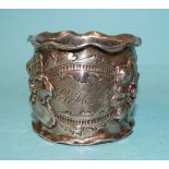 An early-20th century American sterling silver napkin ring by George W Shiebler & Co, cast with