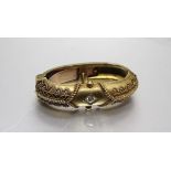 A Victorian 15ct gold cravat clip of oval ring form, with cannetile decoration and set a brilliant-