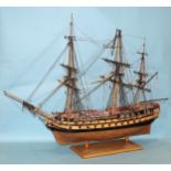 A wooden kit-built model of a 52-gun man o'war three-masted galleon, with copper-plate bull,