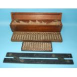 A Chinese turned wood abacus, with Chinese script beneath, 19 x 7cm, a larger abacus, 35 x 8.5cm and