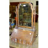 An oak dressing table mirror in the form of a fall-front bureau, with fitted interior and shaped