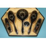 A silver and tortoiseshell five-piece dressing table set with piqué backs, in fitted case, S W Goode